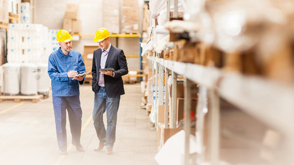 1-men-walking-in-warehouse-0917