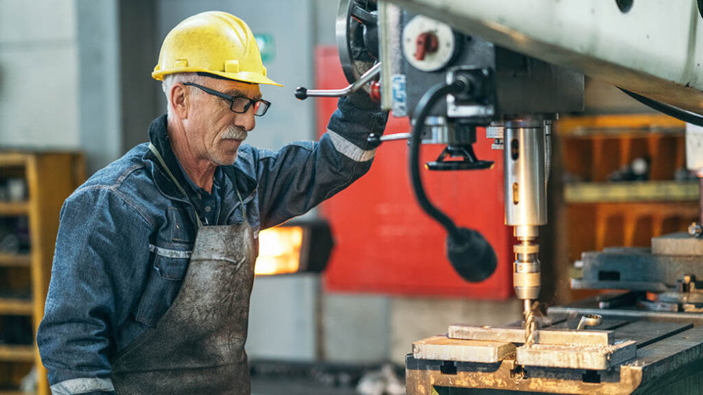 3-turner-worker-working-on-drill-bit-in-a-workshop