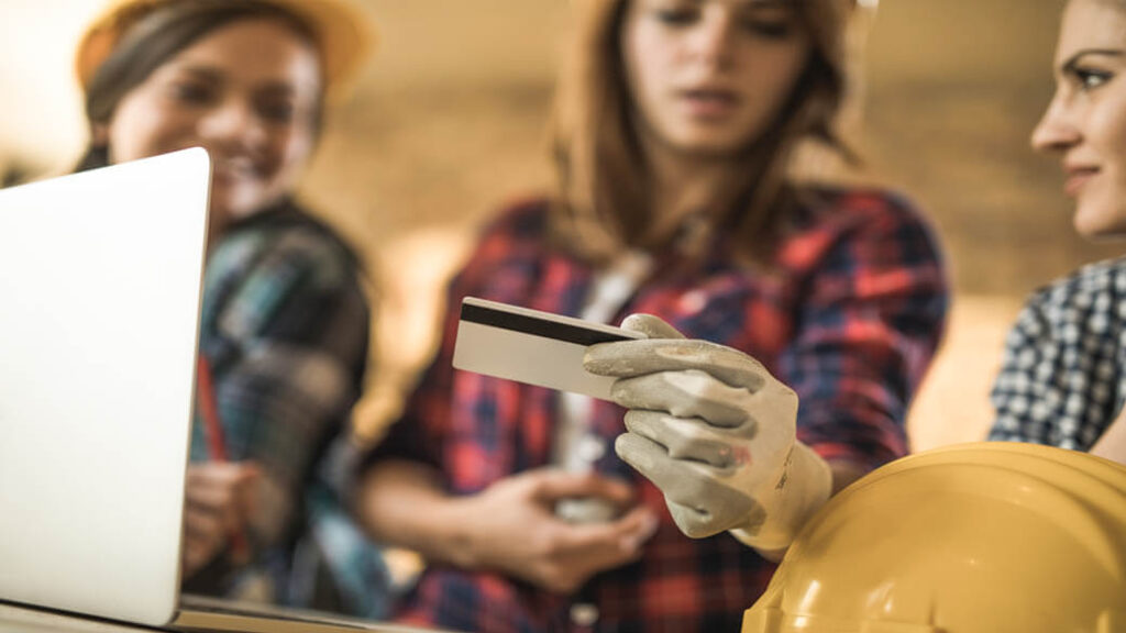 4-female-manual-workers-using-credit-card