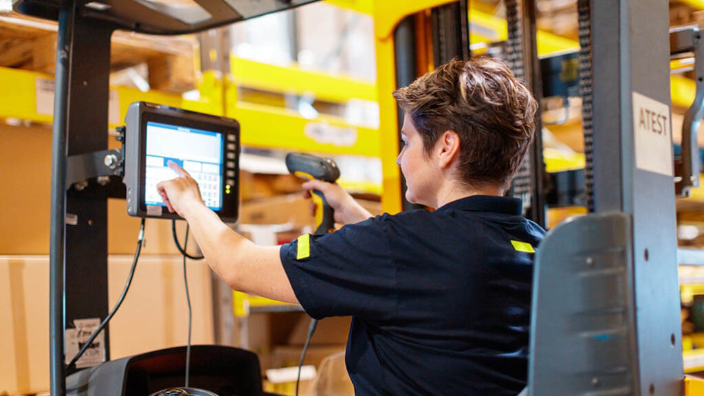 9-female-worker-driving-forklift-in-warehouse