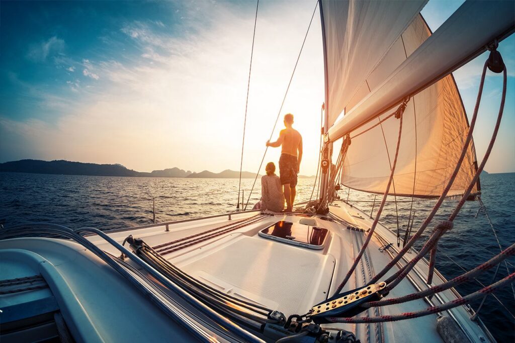 Couple on sailing boat at sea